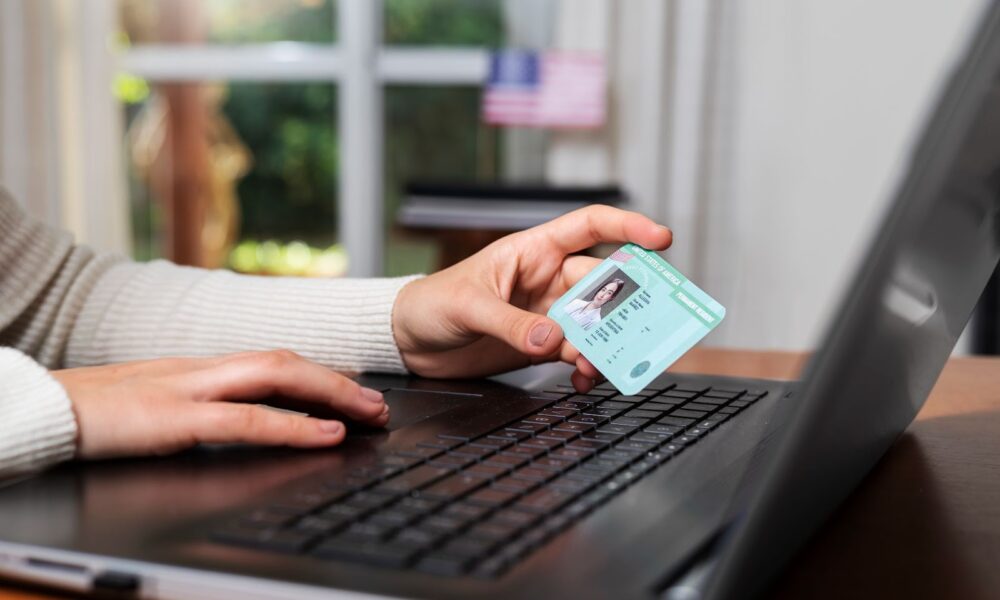 Woman holding her ID